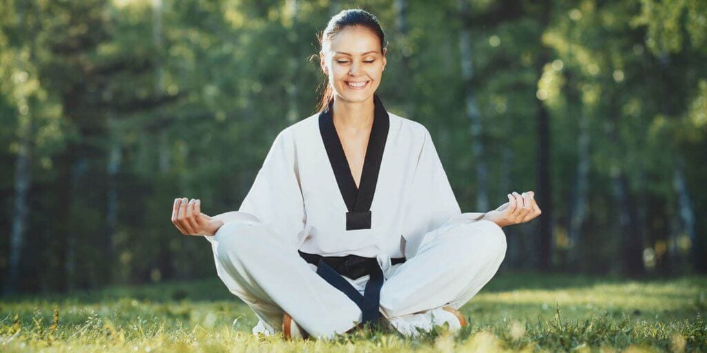 Martial Arts Lessons for Adults in Carmichael CA - Happy Woman Meditated Sitting Background